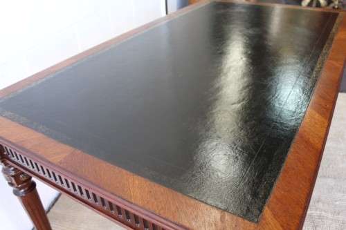 A beautifully detailed vintage Mahogany Regency leather-top library desk with drawers & fluted legs