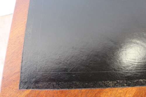 A beautifully detailed vintage Mahogany Regency leather-top library desk with drawers & fluted legs