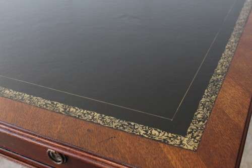 A beautifully detailed vintage Mahogany Regency leather-top library desk with drawers & fluted legs