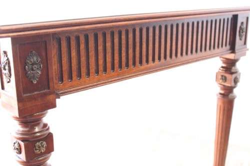 A beautifully detailed vintage Mahogany Regency leather-top library desk with drawers & fluted legs