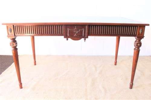 A beautifully detailed vintage Mahogany Regency leather-top library desk with drawers & fluted legs