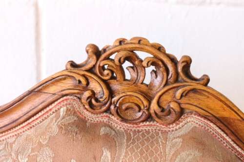 A stunning pair of hand carved ladies parlour chairs with a beautiful pink & cream brocade fabric
