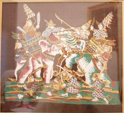**RS17** A framed Oriental warrior scene painting on silk like material w awesome rich colours.