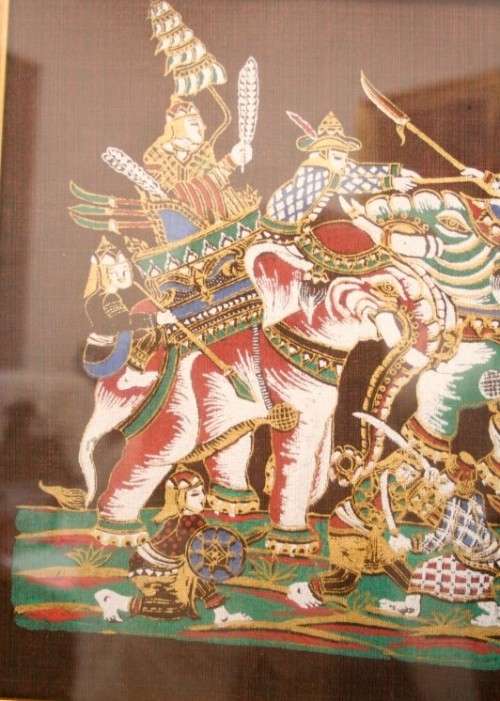 **RS17** A framed Oriental warrior scene painting on silk like material w awesome rich colours.