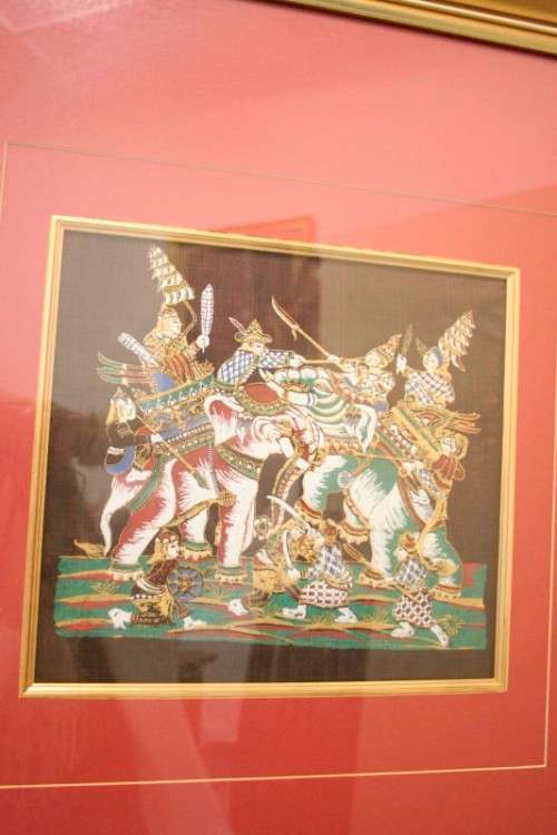 **RS17** A framed Oriental warrior scene painting on silk like material w awesome rich colours.