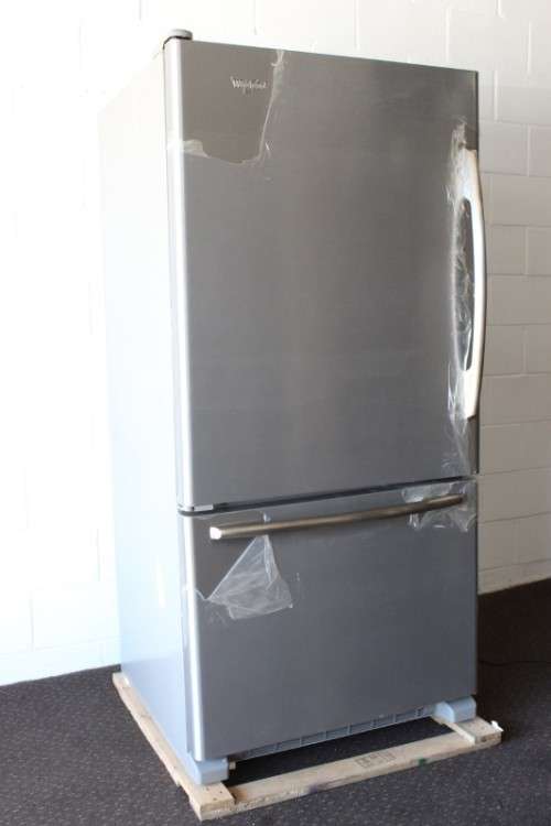 A quality Whirlpool stainless steel bottom freezer 620 litre fridge-freezer combo; never used