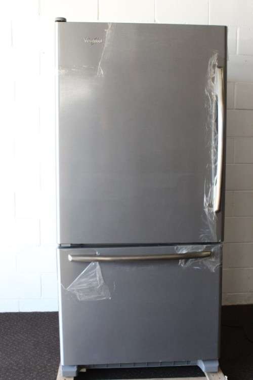 A quality Whirlpool stainless steel bottom freezer 620 litre fridge-freezer combo; never used