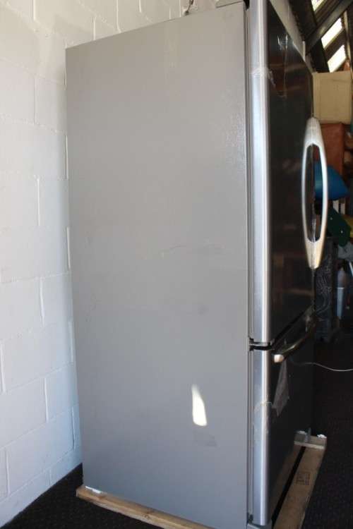 A quality Whirlpool stainless steel bottom freezer 620 litre fridge-freezer combo; never used