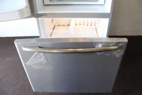 A quality Whirlpool stainless steel bottom freezer 620 litre fridge-freezer combo; never used