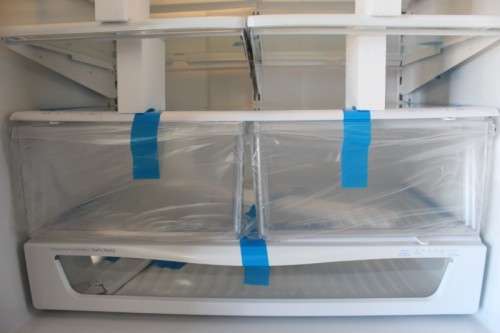 A quality Whirlpool stainless steel bottom freezer 620 litre fridge-freezer combo; never used