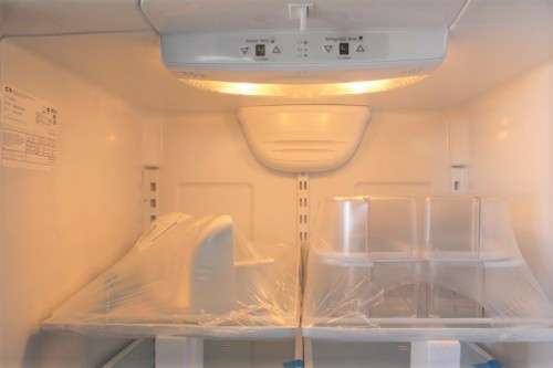 A quality Whirlpool stainless steel bottom freezer 620 litre fridge-freezer combo; never used