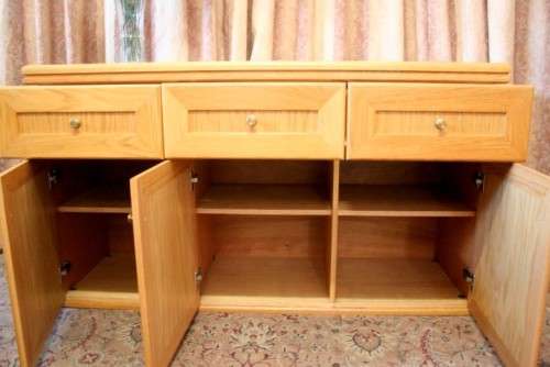 **RS17** A modern Oak side server cabinet with three large drawers and loads of cupboard space.