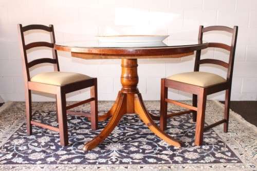 **RS17** A well made round glass-top hall/ foyer table w/ solid turned pedestal leg & broad fascia