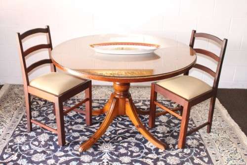 **RS17** A well made round glass-top hall/ foyer table w/ solid turned pedestal leg & broad fascia