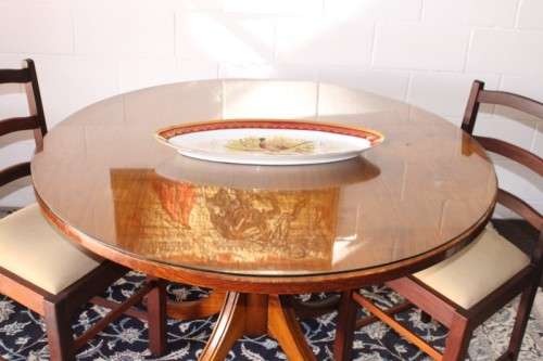 **RS17** A well made round glass-top hall/ foyer table w/ solid turned pedestal leg & broad fascia