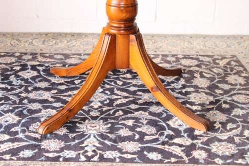 **RS17** A well made round glass-top hall/ foyer table w/ solid turned pedestal leg & broad fascia