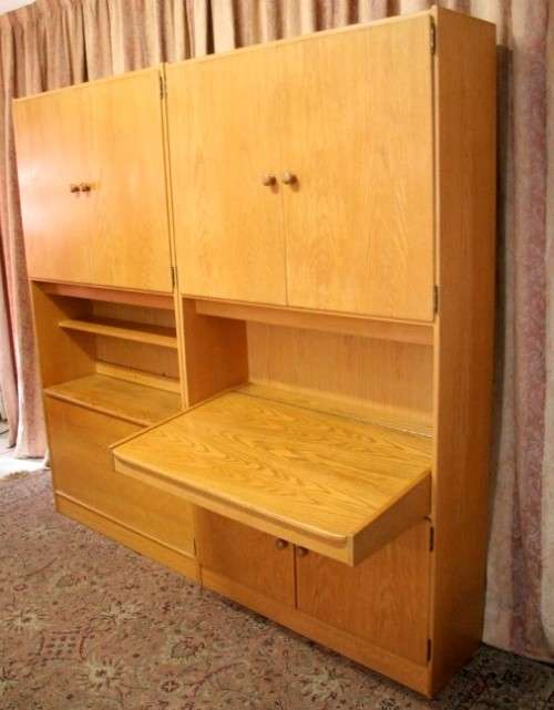 **RS17** A beautifully made wall unit/ cabinet with loads of cupboards and a lift top writing desk.