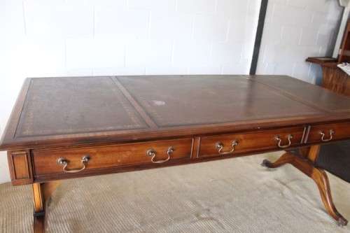 A beautiful vintage Regency styled ladies embossed leather-top 3-drawer writing desk on castors