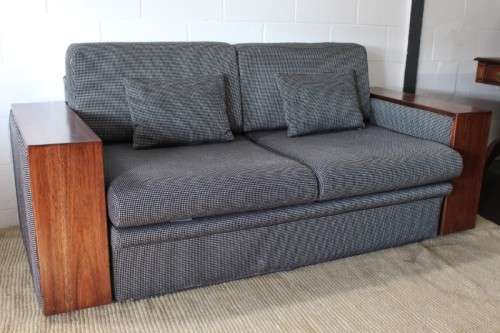 A stylish black and grey combination "Moxi "double-sleeper couch with wooden armrests & cushions