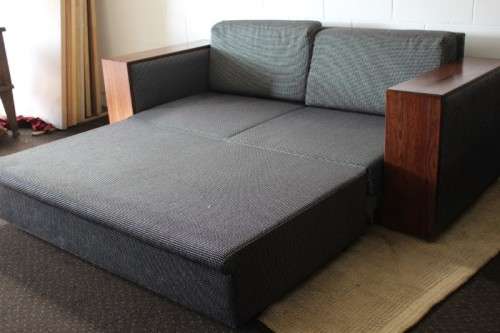 A stylish black and grey combination "Moxi "double-sleeper couch with wooden armrests & cushions