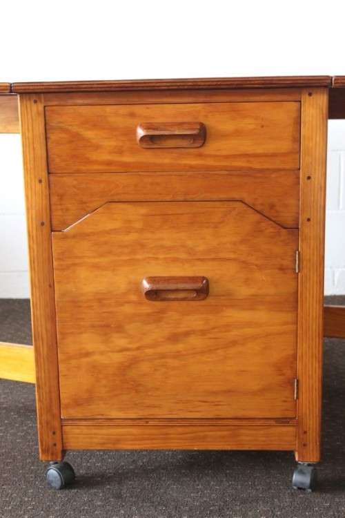 A stunning & unusual vintage oak drop-leaf dining table with a cupboard and three storage drawers