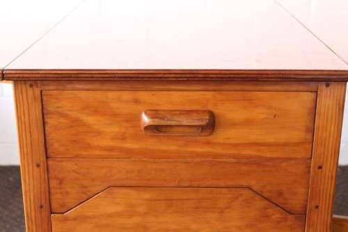 A stunning & unusual vintage oak drop-leaf dining table with a cupboard and three storage drawers