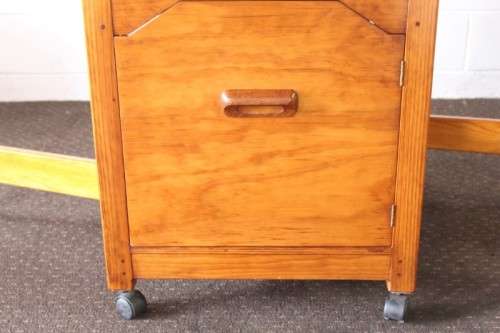 A stunning & unusual vintage oak drop-leaf dining table with a cupboard and three storage drawers