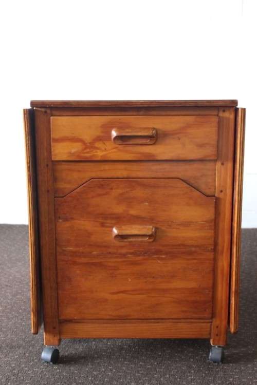 A stunning & unusual vintage oak drop-leaf dining table with a cupboard and three storage drawers