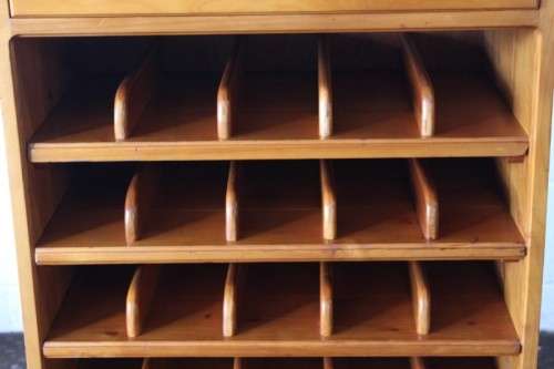 An incredible and beautifully made solid oregon wood 30-bottle wine rack with a smalls drawer