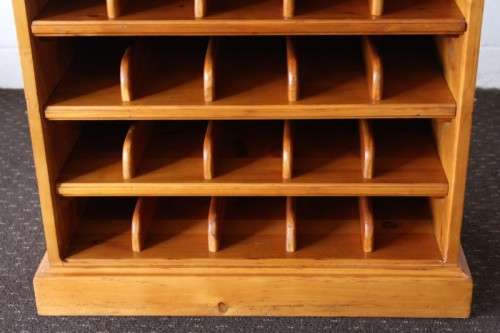 An incredible and beautifully made solid oregon wood 30-bottle wine rack with a smalls drawer