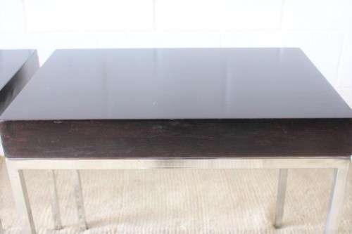 A fabulous pair of modern styled chromed-framed coffee tables with a broad wood profiles