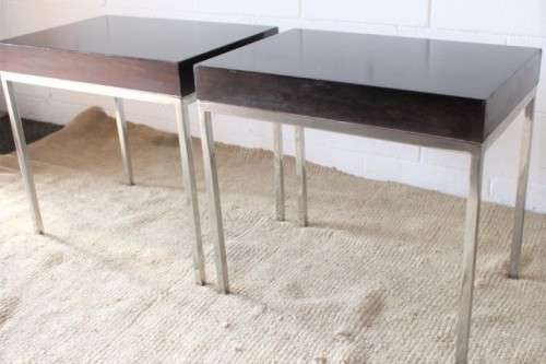 A fabulous pair of modern styled chromed-framed coffee tables with a broad wood profiles