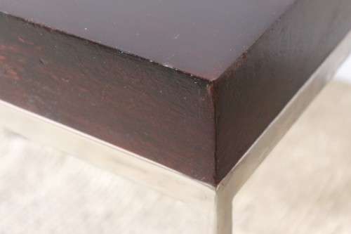 A fabulous pair of modern styled chromed-framed coffee tables with a broad wood profiles