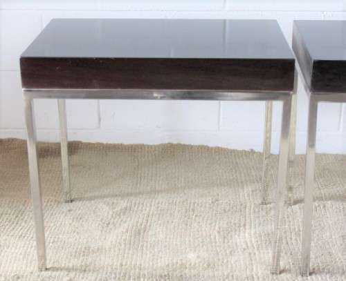 A fabulous pair of modern styled chromed-framed coffee tables with a broad wood profiles