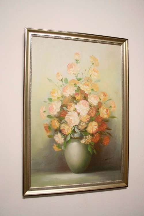 A signed & framed original oil painting of flowers by American artist "C Tommy"
