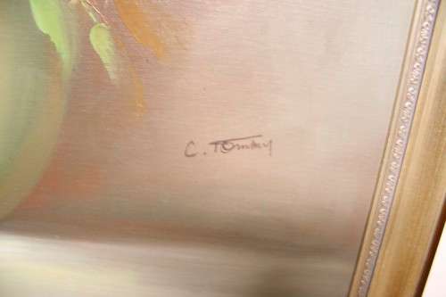 A signed & framed original oil painting of flowers by American artist "C Tommy"