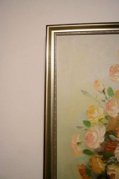 A signed & framed original oil painting of flowers by American artist "C Tommy"