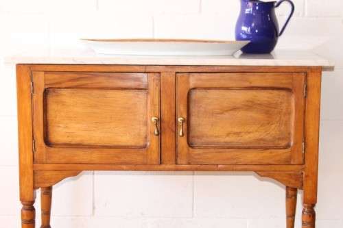 A wonderful vintage solid Oak double door wash stand with a white marble top on castors - stunning!