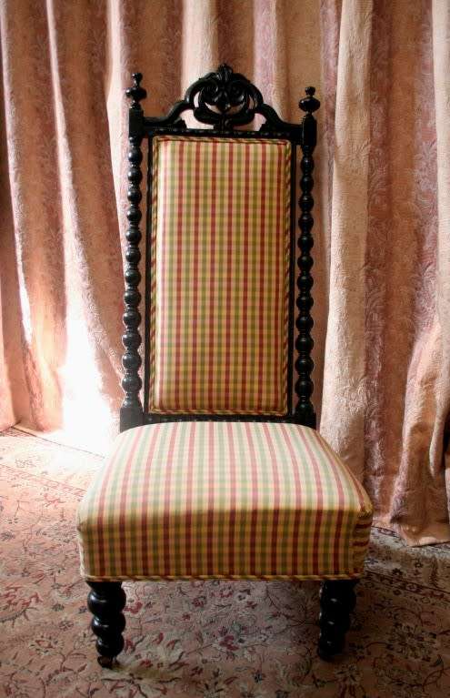 **RS17** A gorgeous Victorian "parlour chair" w/ carved detailing & chequered upholstery on castors.