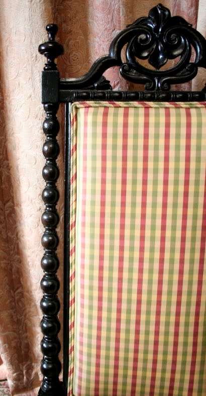 **RS17** A gorgeous Victorian "parlour chair" w/ carved detailing & chequered upholstery on castors.