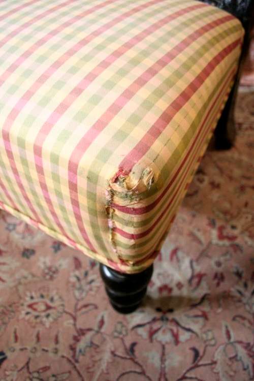 **RS17** A gorgeous Victorian "parlour chair" w/ carved detailing & chequered upholstery on castors.