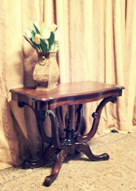 A fabulous vintage Teak hallway/display table with ornate carved finial & detailing at the bottom