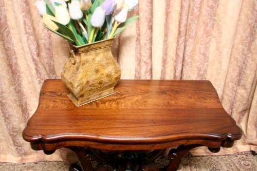 A fabulous vintage Teak hallway/display table with ornate carved finial & detailing at the bottom