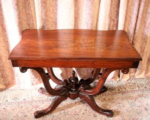 A fabulous vintage Teak hallway/display table with ornate carved finial & detailing at the bottom