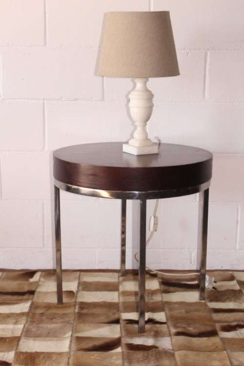 A wonderful modern styled round steel frame coffee/ side table with a broad wood profile