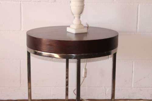 A wonderful modern styled round steel frame coffee/ side table with a broad wood profile