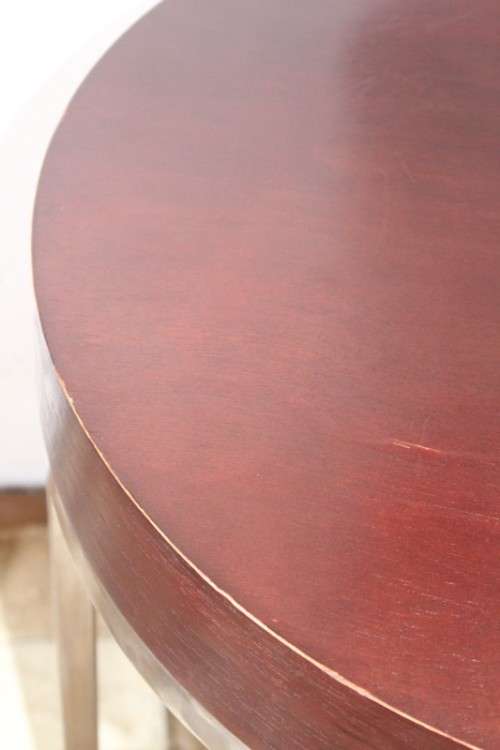 A wonderful modern styled round steel frame coffee/ side table with a broad wood profile