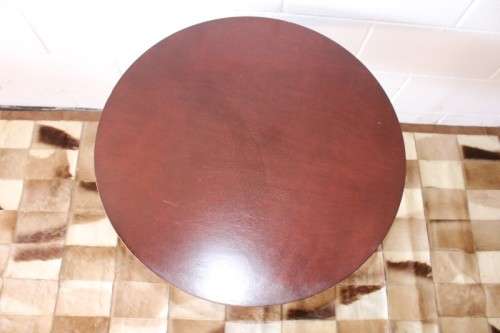 A wonderful modern styled round steel frame coffee/ side table with a broad wood profile