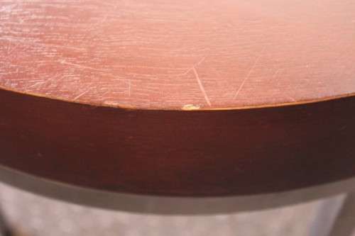 A wonderful modern styled round steel frame coffee/ side table with a broad wood profile