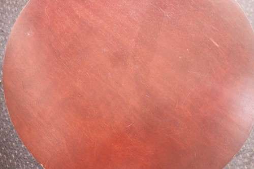 A wonderful modern styled round steel frame coffee/ side table with a broad wood profile